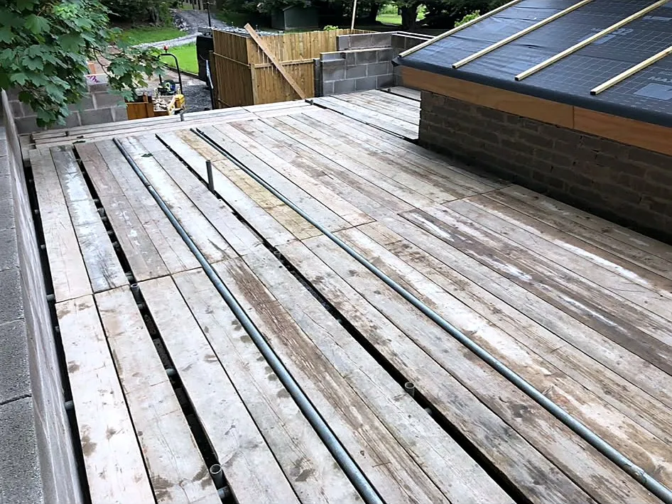 Fully boarded birdcage platform over an extension